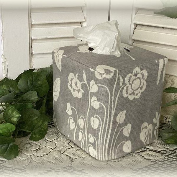 Decorator cotton fabric with floral motif in white on a gray background tissue box cover