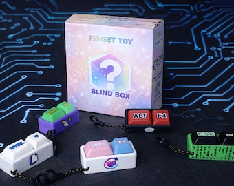 May include: A collection of colorful fidget toys shaped like keyboard keys, including "CTRL", "ALT", "F4", "ESC", and "LOVE F5". A "Fidget Toy Blind Box" is in the background, with a question mark graphic. The background is a dark surface with a circuit board design.