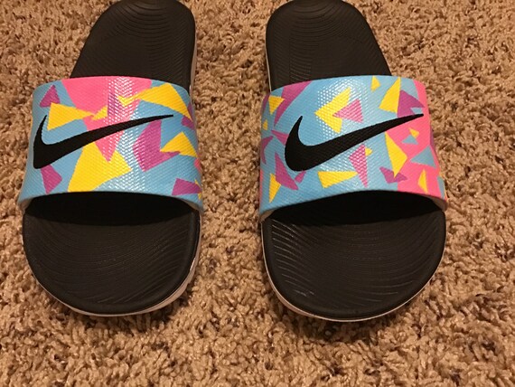 multi colored nike slides