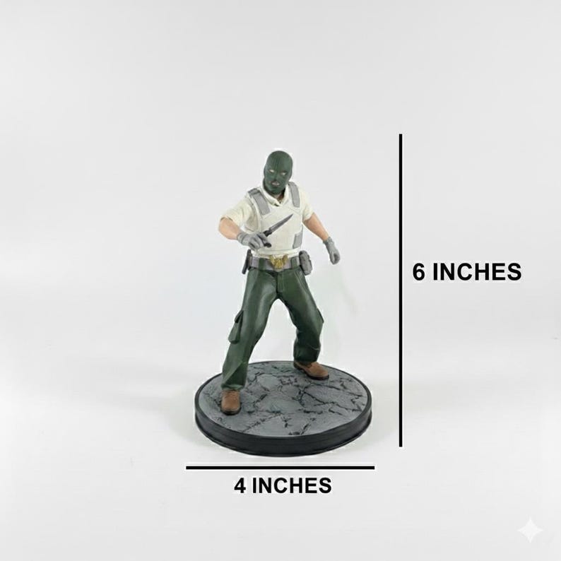 May include: A figurine of a character in a green mask, shirt, and pants, holding a knife. The figure stands on a 4-inch diameter base and is 6 inches tall. The base is a dark gray color with a textured surface.