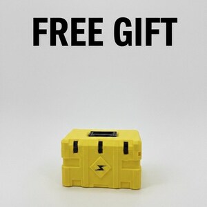 May include: A yellow box with black accents and a lightning bolt symbol on the front. The text "FREE GIFT" is displayed above the box in bold, black letters. The box is sitting on a white surface.