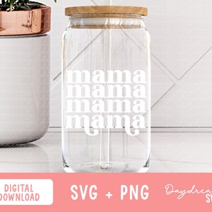 May include: A clear glass tumbler with a wooden lid and a straw. The word "mama" is printed in white, stacked four times down the front of the glass. The tumbler is next to a white ceramic pot with a copper-colored rim.