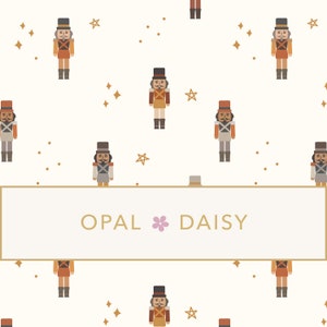 May include: A white background with a repeating pattern of nutcracker soldiers, gold stars, and gold dots. The text "OPAL DAISY" is centered in a gold frame.