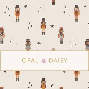 May include: A seamless pattern featuring a repeating design of nutcracker soldiers, stars, and dots on a light beige background. The text "OPAL DAISY" is centered in the pattern.