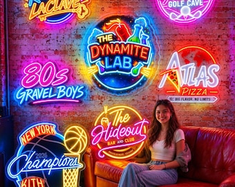 May include: A collection of vibrant neon signs mounted on a brick wall, featuring various designs including Bar Karaoke LaClave, Glennie Golf Cave, The Dynamite Lab, 80s Gravel Boys, Atlas Pizza, New York Champions 2026 Kith, and The Hideout.
