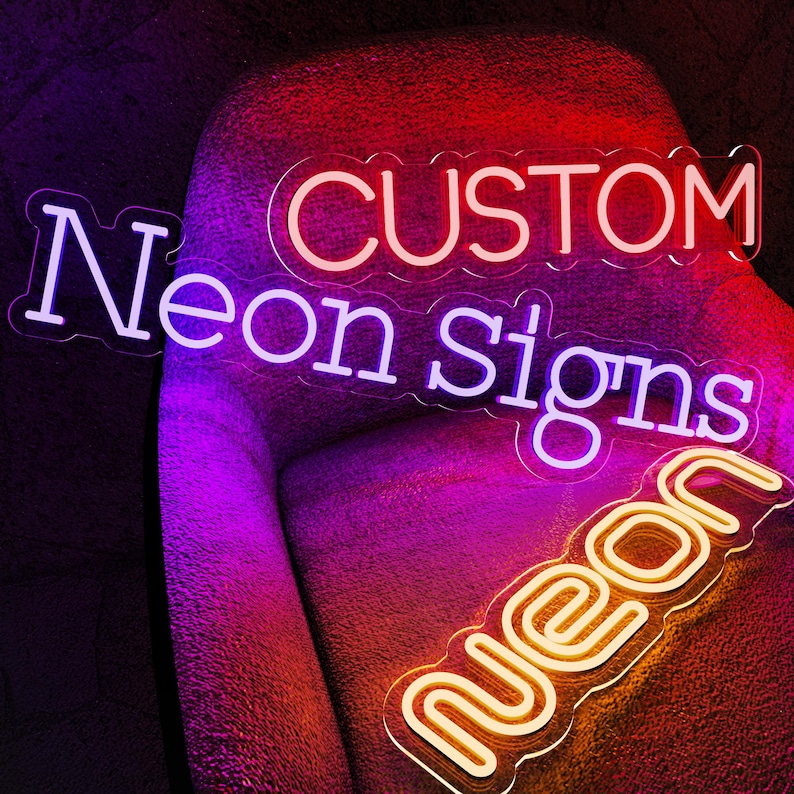 May include: A custom neon sign featuring the text CUSTOM in red, Neon Signs in purple, and neon in yellow, all mounted on clear acrylic backings with contoured edges. The signs emit a vibrant glow against a dark, textured background.