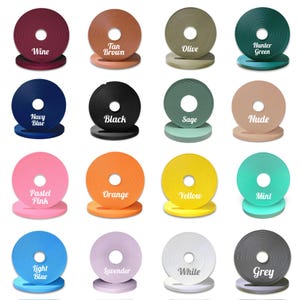 May include: A collection of 16 different colored fabric samples, each with a white circle in the center. The colors include wine, tan brown, olive, hunter green, navy blue, black, sage, nude, pastel pink, orange, yellow, mint, light blue, lavender, white, and grey.