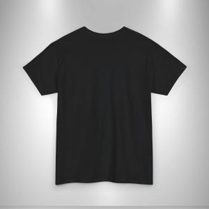 May include: A plain black t-shirt with short sleeves. The shirt is made of a soft material and has a crew neck. The t-shirt is displayed on a light gray background.