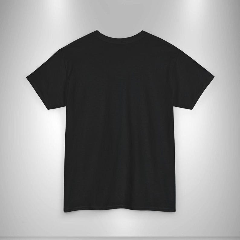 May include: A plain black t-shirt with short sleeves. The shirt is made of a soft material and has a crew neck. The t-shirt is displayed on a light gray background.
