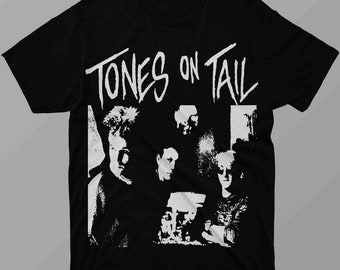 May include: Black t-shirt with a white graphic print of a band called "Tones on Tail". The graphic features a black and white image of the band members.