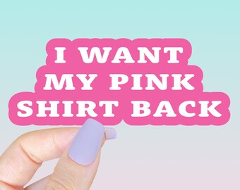 May include: A pink die-cut sticker featuring the white text I WANT MY PINK SHIRT BACK in a bold, sans-serif font. The sticker has a smooth, rounded edge contour that follows the shape of the three lines of text, creating a cohesive graphic design.