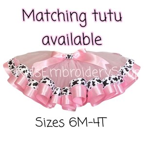 May include: Pink tulle tutu with black and white cow print ribbon trim. Sizes 6M-4T. Matching tutu available.