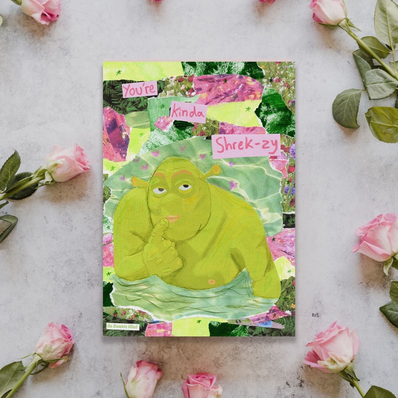 May include: A collage card with a green ogre character from the movie Shrek. The card has pink and green text that reads "You're kinda Shrek-zy".