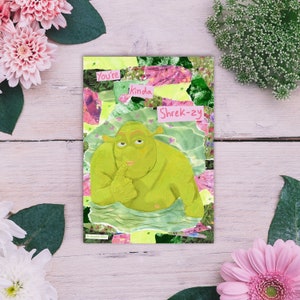 May include: A collage card featuring a green ogre with a pink and green background. The card says "You're kinda Shrek-zy".