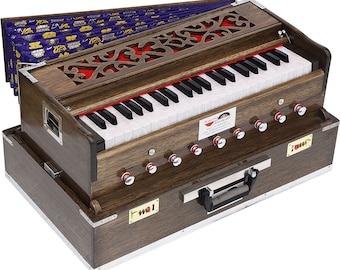 May include: A brown wooden harmonium with a keyboard, bellows, and a set of knobs. The harmonium has a floral patterned fabric cover and a metal carrying handle.