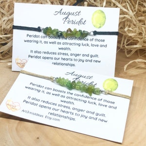 May include: A green peridot stone bracelet with a black cord and a white card that reads "August Peridot". The card says that peridot can boost confidence, attract luck, love, and wealth. It also reduces stress, anger, and guilt. Peridot opens hearts to joy and new relationships.