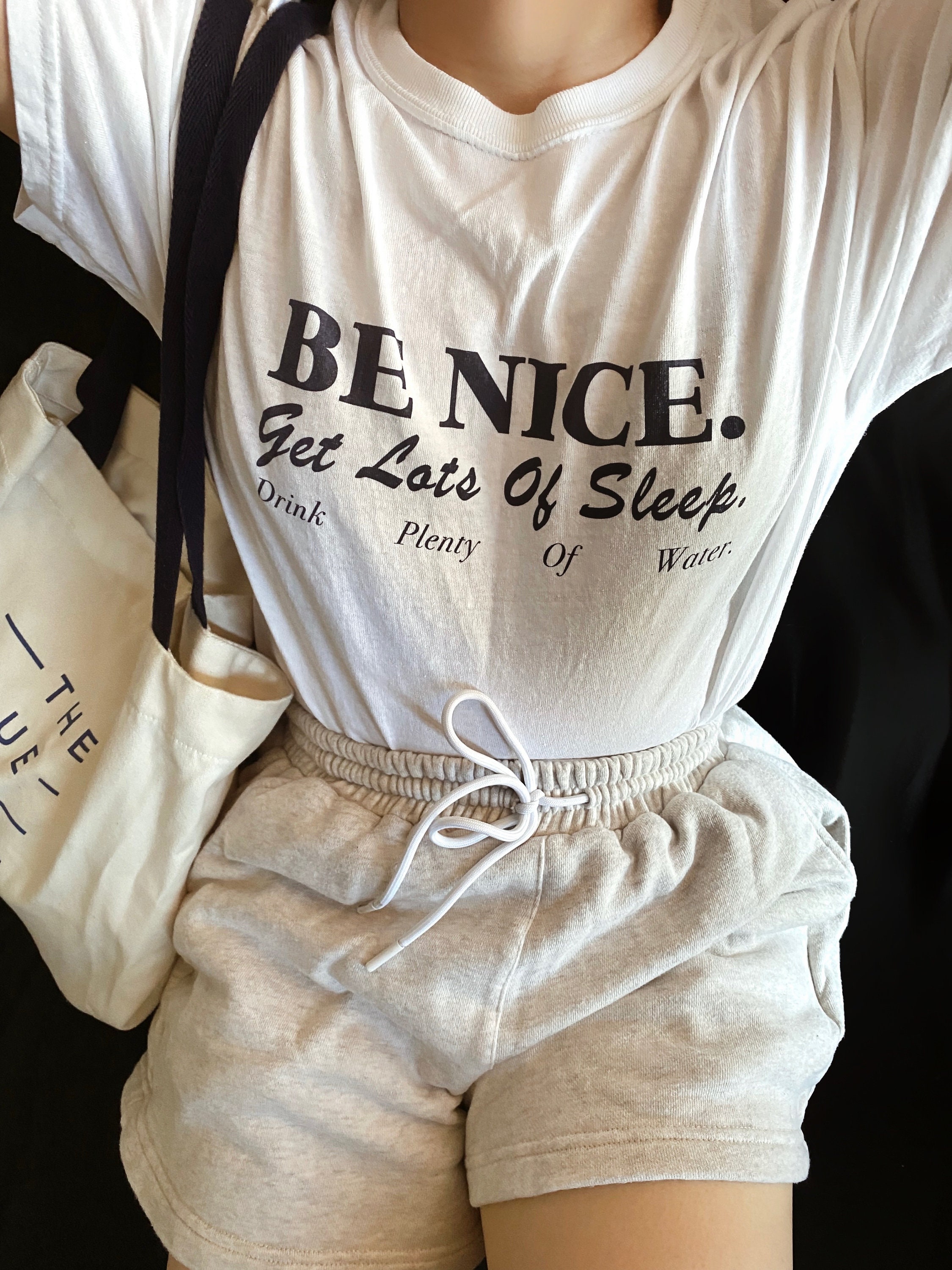 white shirt with blue writing