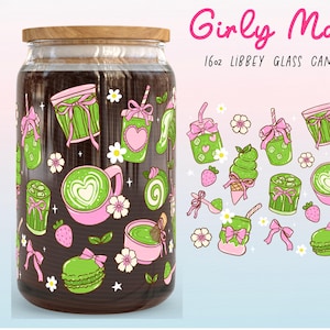 May include: A glass can wrap with a wooden lid, featuring a "Girly Matcha Lover" design. The wrap is adorned with green and pink illustrations of matcha drinks, desserts, and flowers. The can wrap measures 9.75" x 5".