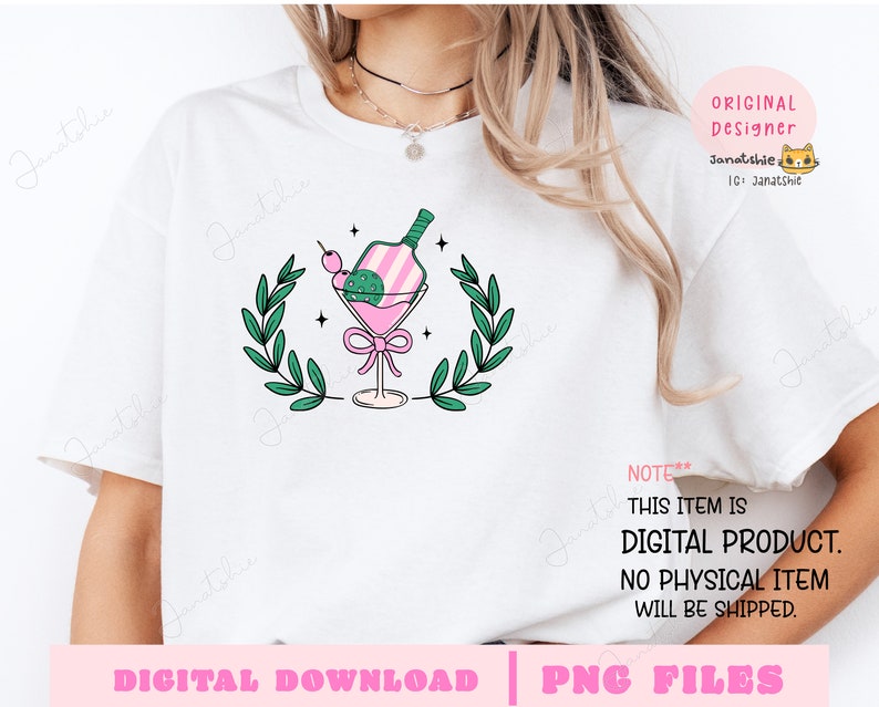 May include: A white t-shirt with a pink and green illustration of a cocktail glass with a bottle inside. The illustration is surrounded by green leaves. The text "NOTE** THIS ITEM IS DIGITAL PRODUCT. NO PHYSICAL ITEM WILL BE SHIPPED." is at the bottom of the shirt.