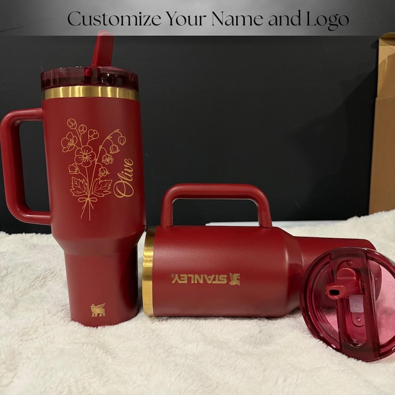 Gold laser engraved Stanley style 40oz tumbler featuring a personalized name, designed as a unique birthday gift for women. Includes a flip straw lid and sturdy handle for convenience and daily use. This insulated tumbler keeps beverages hot or cold for extended periods and offers a stylish and modern look, making it a thoughtful and practical personalized gift.