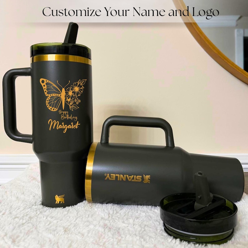 Gold laser engraved Stanley style 40oz tumbler featuring a personalized name, designed as a unique birthday gift for women. Includes a flip straw lid and sturdy handle for convenience and daily use. This insulated tumbler keeps beverages hot or cold for extended periods and offers a stylish and modern look, making it a thoughtful and practical personalized gift.
