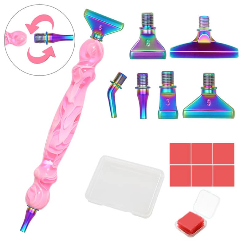 May include: A pink and white marbled diamond painting pen with multiple iridescent tips. Includes a clear plastic tray, red wax squares, and a small clear container. The pen has a screw-in tip and is shown with different tip options.