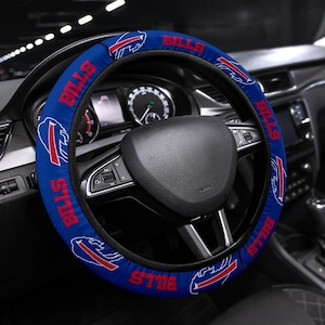May include: Blue and red steering wheel cover with the Buffalo Bills logo and the word "Bills" repeated around the cover.