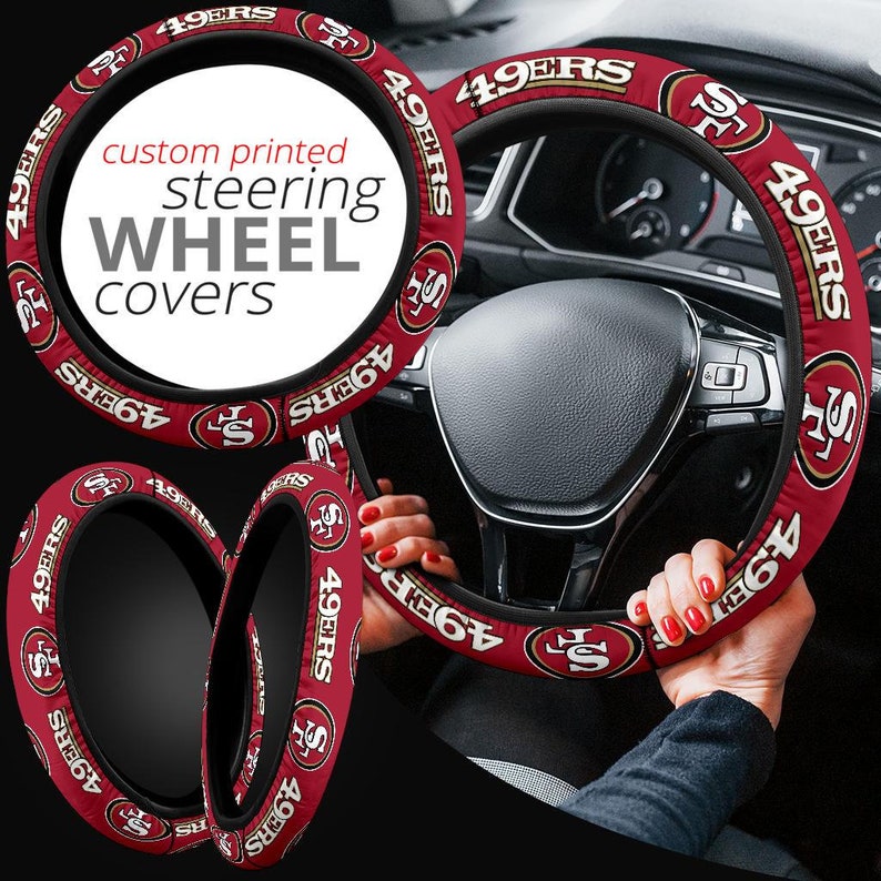 May include: Red and gold steering wheel cover with the text "49ERS" repeated around the cover. The text "custom printed steering wheel covers" is displayed on the cover.