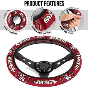 May include: A red and gold steering wheel cover with the San Francisco 49ers logo. The cover is made of breathable, sweat-absorbing material and has a soft, comfortable texture.