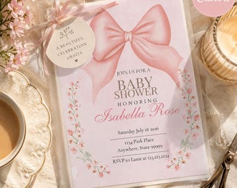 Può includere: Un biglietto d'invito per baby shower con un grande fiocco rosa in alto e bordi floreali. Il testo recita: Join us for a baby shower honoring Isabella Rose, Saturday July 18 2026, 1234 Park Place, Anywhere, State 99999, RSVP to Lanie at 123.123.1234.