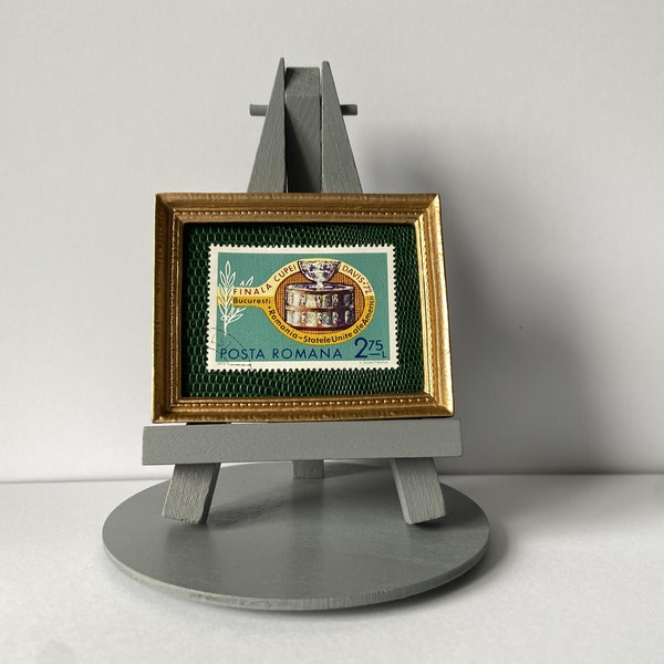 Tennis ornament - Framed 1972 postage stamp of a tennis racket with the Davis Cup trophy on it with a grey easel, base & gift wrap included