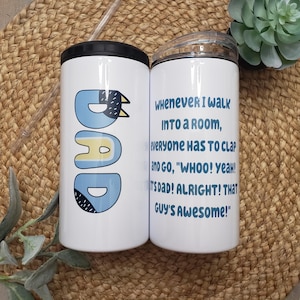 May include: Two white cylindrical tumblers with black lids. One features the word DAD in blue with black accents. The other displays the text: WHENEVER I WALK INTO A ROOM, EVERYONE HAS TO CLAP AND GO, WHOO! YEAH! IT'S DAD! ALRIGHT! THAT GUY'S AWESOME!