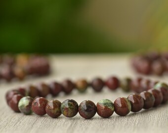 Bracciale con pietra di sangue di drago: braccialetto elastico con pietra preziosa rotonda