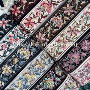 May include: Assortment of floral embroidered trim in various colors, including black, white, pink, and brown. The trim features intricate floral designs and is perfect for adding a touch of elegance to any project.