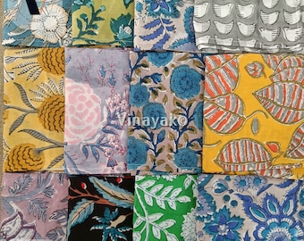 May include: A set of 10 fabric squares with various floral and geometric patterns in shades of blue, green, yellow, pink, and gray. The fabric squares are arranged in a grid pattern. The text "Npn001" is visible in the lower left corner of the image.