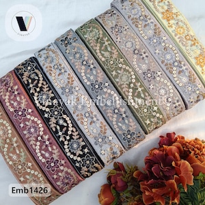 May include: Assortment of 10 embroidered trim ribbons with sequins in various colors, including gold, silver, pink, and green. The trim is approximately 1 inch wide. The image includes the text "Emb1426".