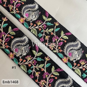 May include: Black embroidered trim with a floral design and gray squirrels. The trim has pink, green, and orange accents. The trim is labeled #1 and Emb1468.