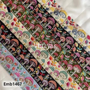 May include: A collection of colorful embroidered trims featuring a mushroom design. The trims are arranged in a row, with each trim having a different color scheme and pattern. The trims are made of a soft, delicate fabric and are perfect for adding a touch of whimsy to any project.