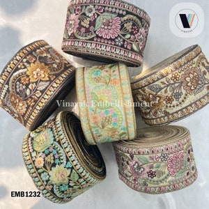May include: Five rolls of embroidered trim with floral patterns in various colors, including black, brown, gold, pink, and green. The trim is decorated with sequins and beads. The trim is labeled "EMB1232".