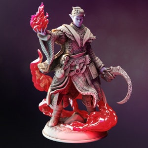 May include: A blue-skinned elf figurine wearing a detailed, white robe with a red flame in one hand and a curved blade in the other. The figurine is standing on a base with red flames.