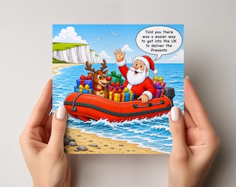 May include: A square greeting card illustration featuring Santa Claus and a reindeer in a bright red inflatable boat on blue water near white cliffs. Santa waves and a speech bubble reads: Told you there was a easier way to get into the UK to deliver the Presents.