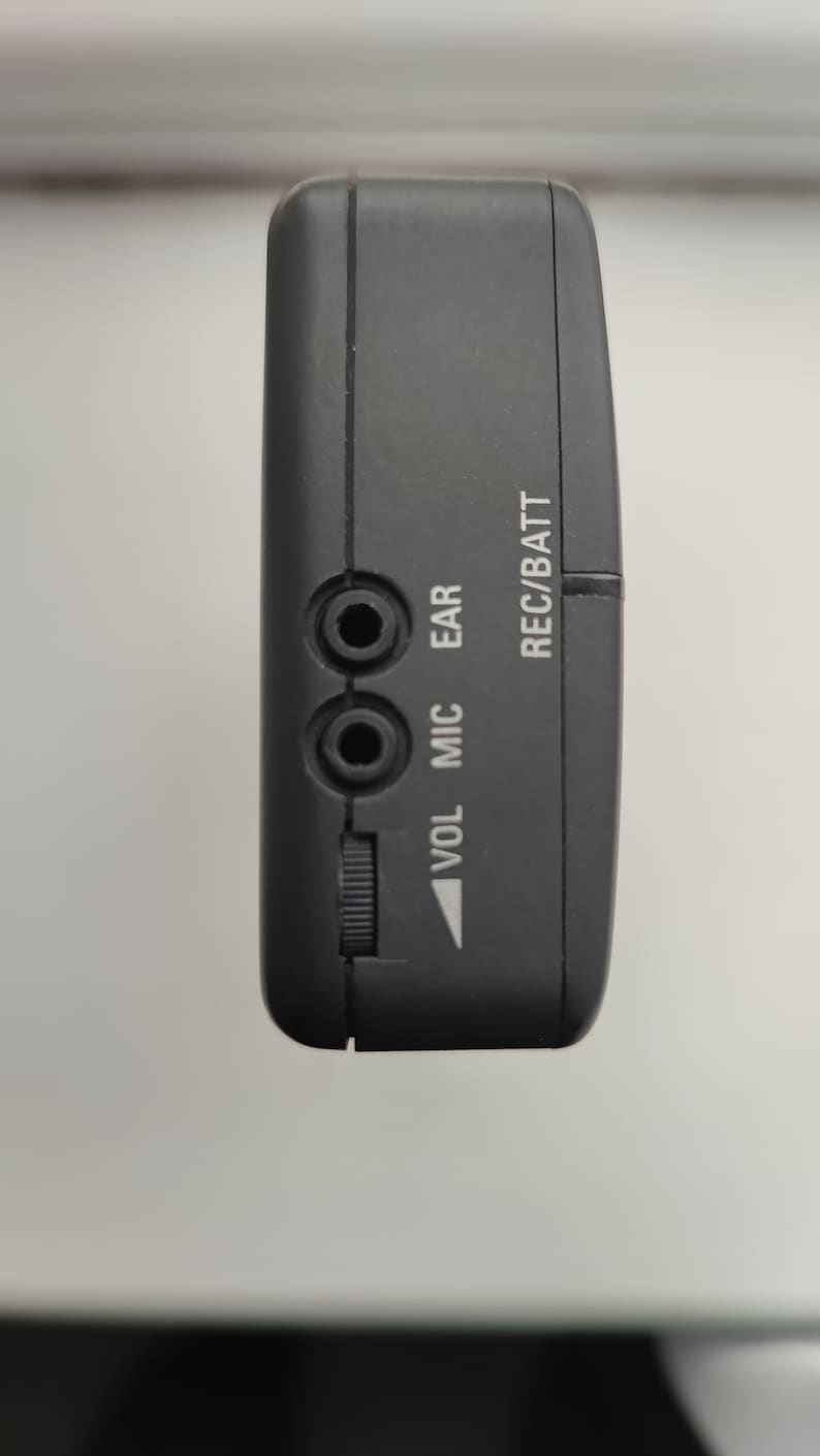 May include: Black cassette player with a volume knob, microphone and ear jack inputs, and REC/BATT label.