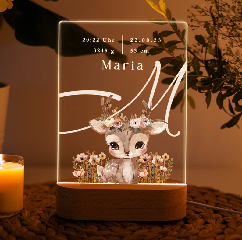 May include: A wooden night light with a clear acrylic panel featuring a cute cartoon deer with a floral crown. The panel also displays the text "20:22 Uhr 22.08.23 3245 g 53 cm Maria".