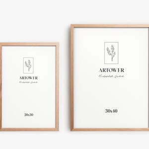 May include: Two wooden picture frames with white matting. The frames are light brown and rectangular. The smaller frame is labeled "20x30" and the larger frame is labeled "30x40". Each frame has the "ARTOWER" logo and a botanical illustration.