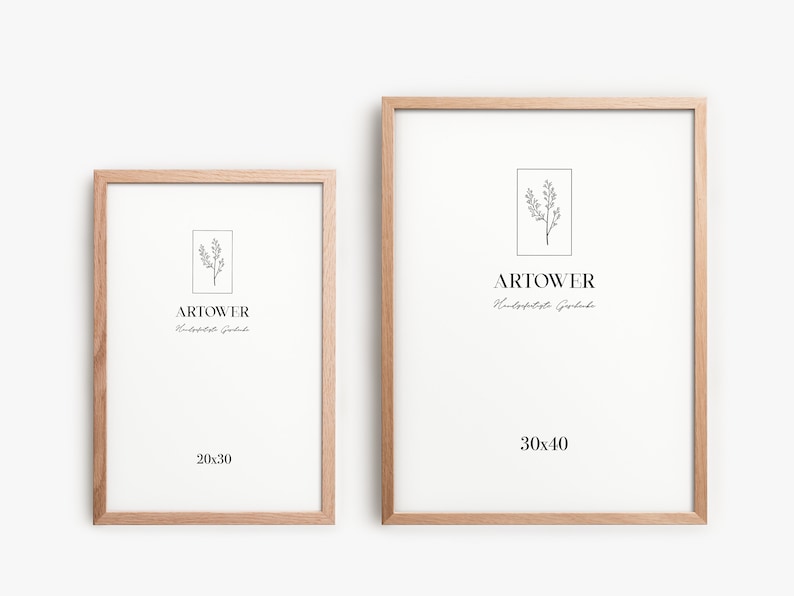 May include: Two wooden picture frames with white matting. The frames are light brown and rectangular. The smaller frame is labeled "20x30" and the larger frame is labeled "30x40". Each frame has the "ARTOWER" logo and a botanical illustration.