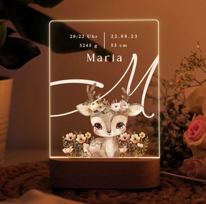 May include: A white acrylic night light with a deer illustration and the name "Maria" printed on it. The light also displays the time 20:22, weight 3245 g, and length 53 cm.
