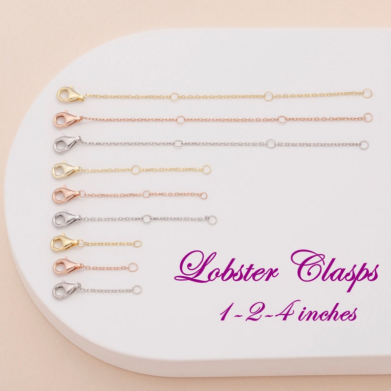 May include: A set of eight gold, rose gold, and silver lobster clasps in various lengths, ranging from 1 to 4 inches. The clasps are displayed on a white surface.
