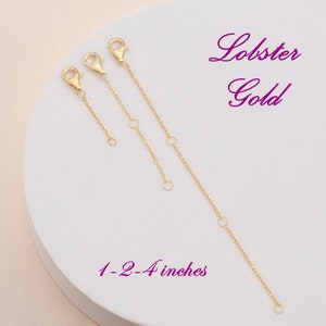 May include: Three gold lobster claw clasps with jump rings. The clasps are 1, 2, and 4 inches long.  Lobster Gold 1-2-4 inches.