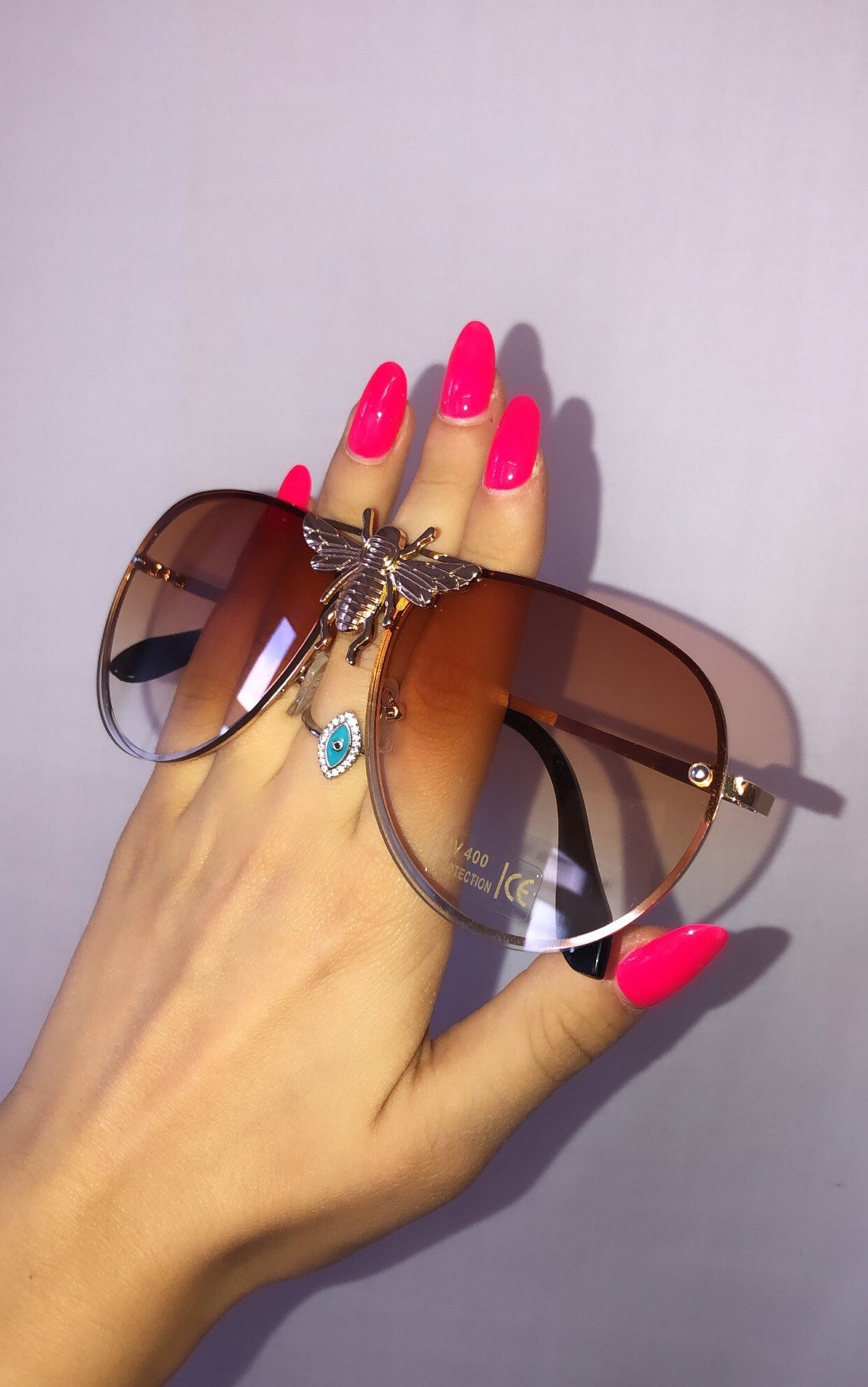 sunglasses with gold bee