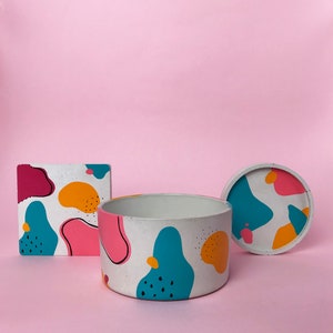 Round concrete trinket dish with multi-coloured abstract pattern image 3